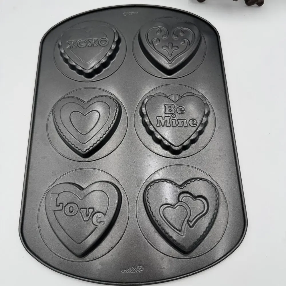 Set of 2 Wilton Gingerbread Man and Valentine Non-Stick Pans